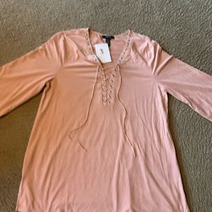 Salmon color top.
